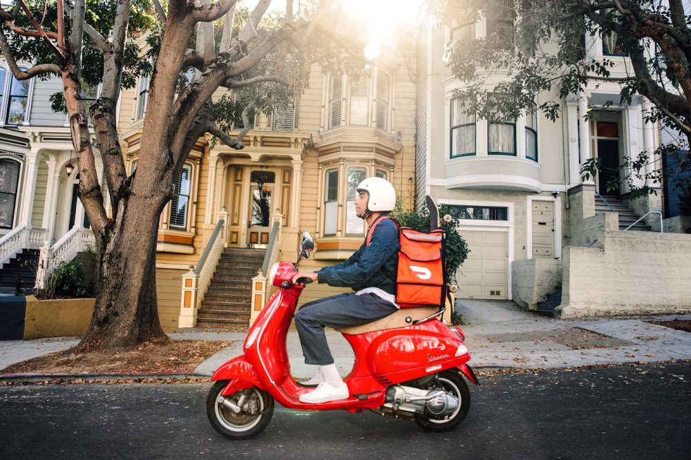 Doordash delivery driver on moped